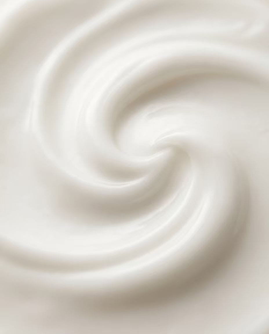 Sorbitan Trioleate (Span 85) acts as an emulsifier in a silky white cosmetic cream with elegant swirls, demonstrating flawless emulsion stability and smooth texture for premium skincare formulations.